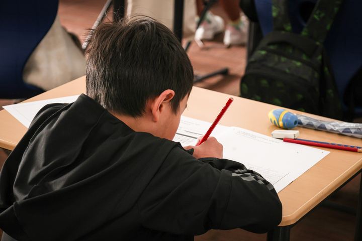 A student working through the question booklet