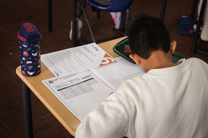 A student checking the answer sheet